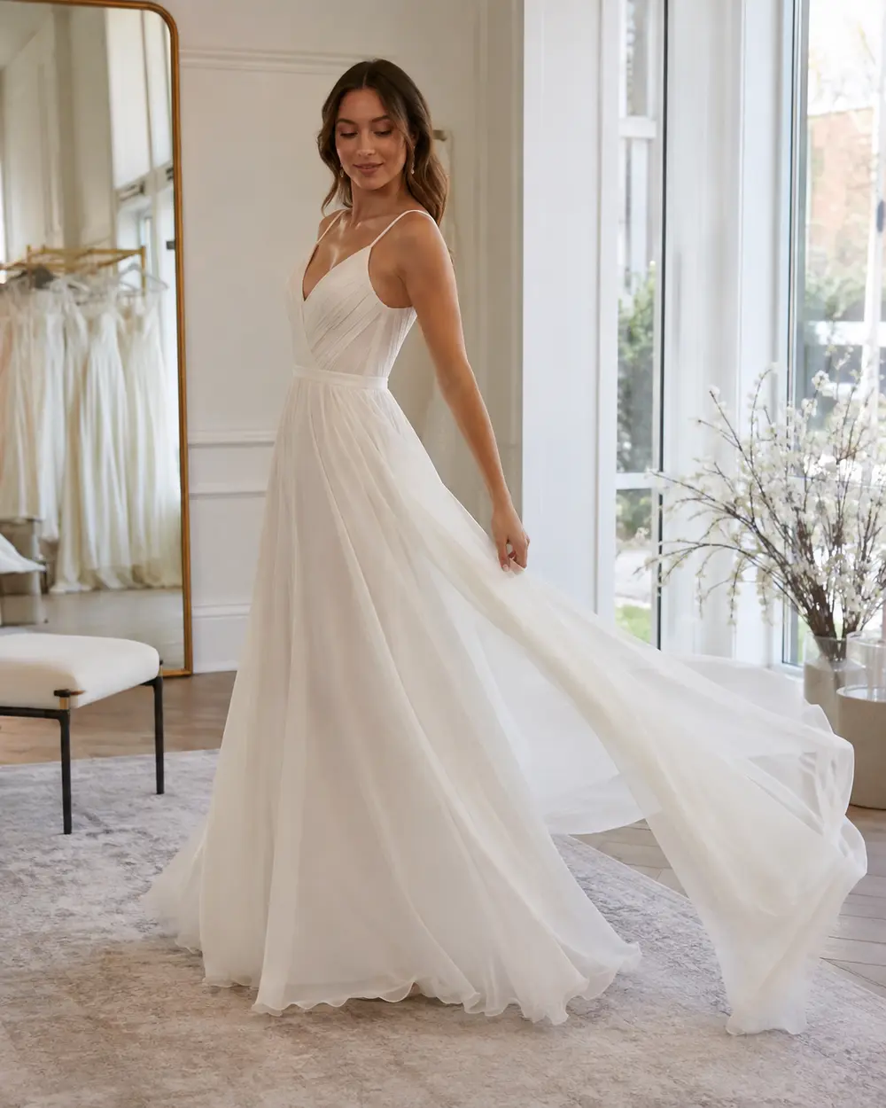 chiffon-wedding-dress-movement Bride testing the movement of a chiffon wedding dress